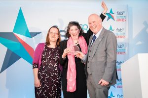 Sharing Parenting’s Outreach Worker, Amba Keeble and Director, Suzanne Pearson receiving the FSB Community Award  at Newmarket Racecourse. 